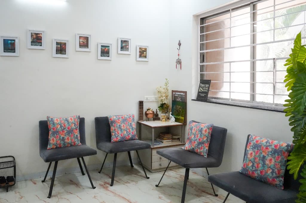 Welcoming waiting area at Oracare Dental Care Center Pune with comfortable seating and educational dental displays